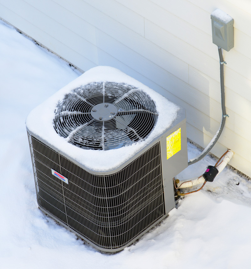 HVAC unit outside during the winter.